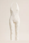 White lace bodysuit on a light beige background